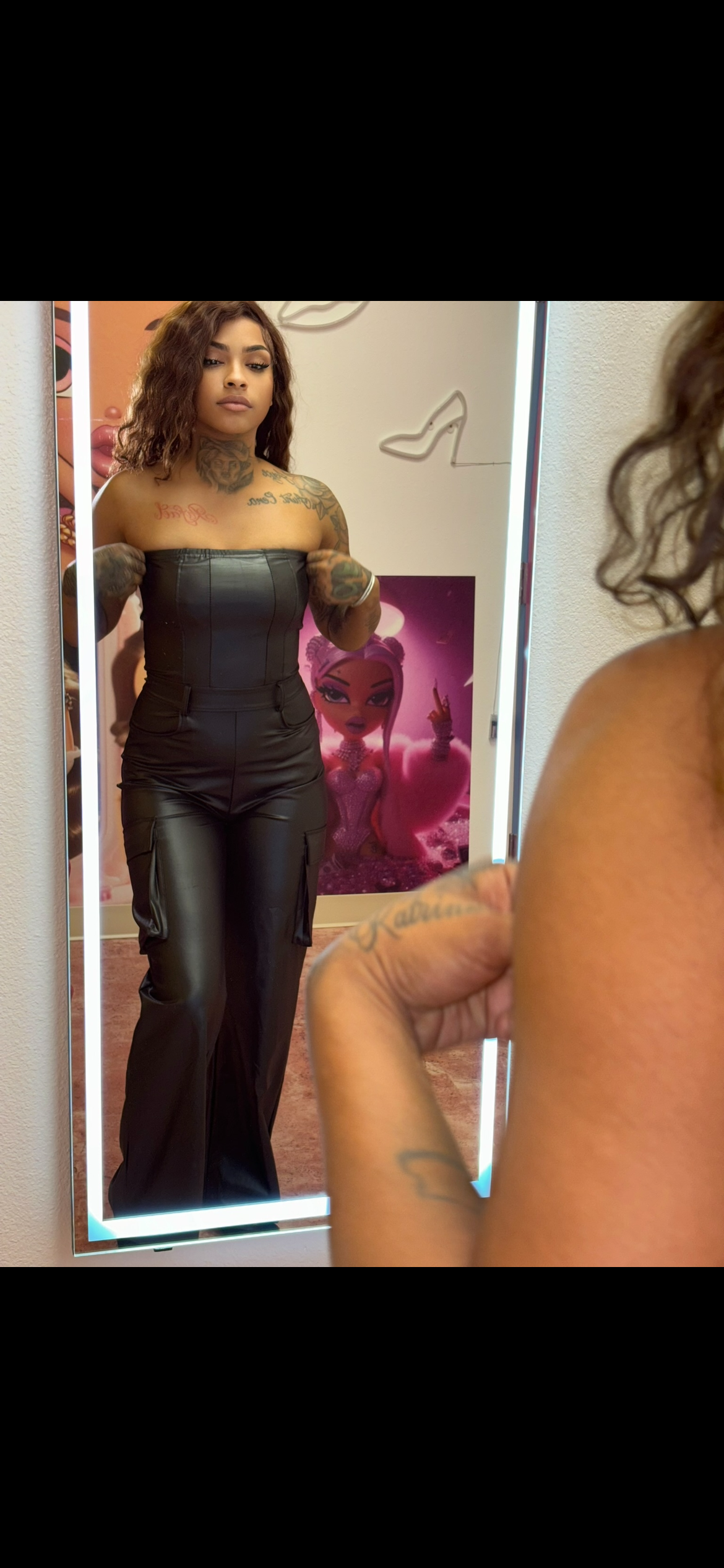 Business in black jumpsuit